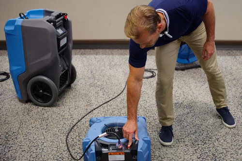 Air mover used alongside commercial dehumidifier to improve drying efficiency