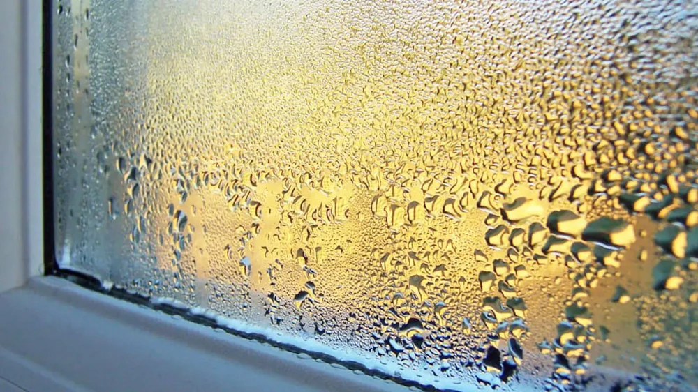 condensation forming on bedroom window overnight due to high humidity