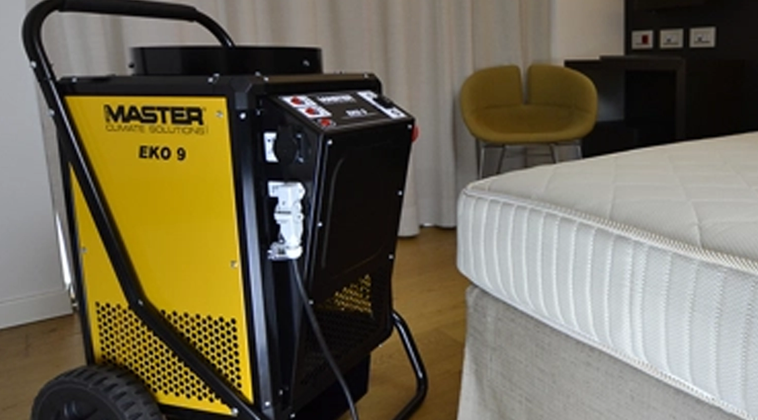 The electronics inside a bedbug heater are safe for use inside warm rooms A picture of an eko 9 situated next to a mattress