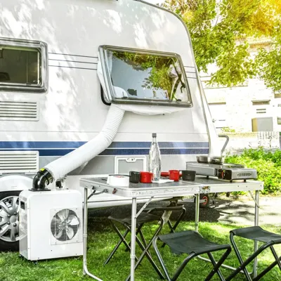 Trotec PT 2000 SP Portable Air Conditioner 240v next to a caravan